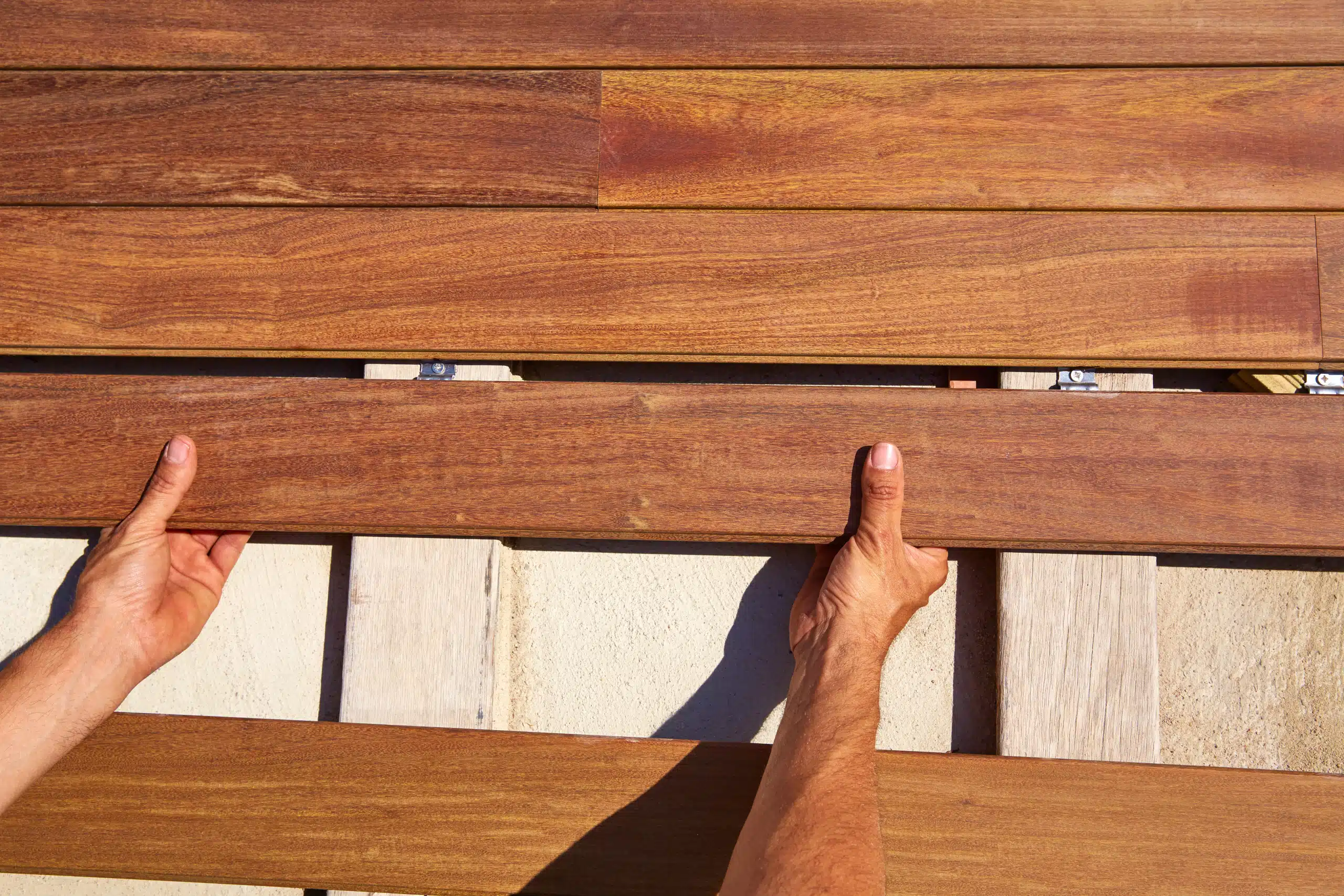 hands holding a wood