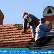 two roofers working