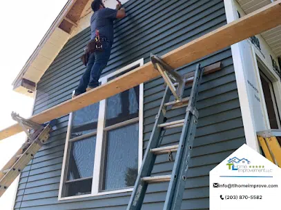 man working on the wall of the house